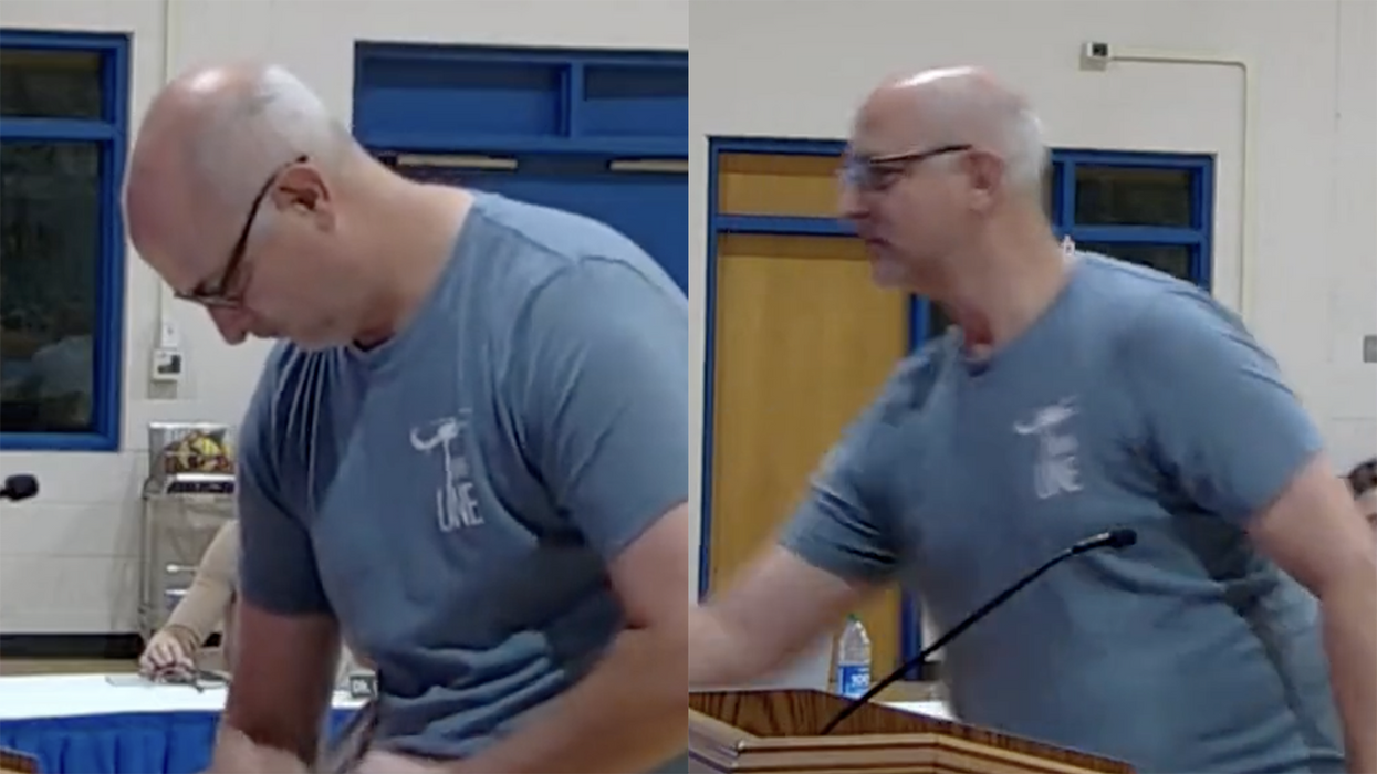 Dad claims school board is too "chicken" to remove porn from schools, so he throws chicken feed at them