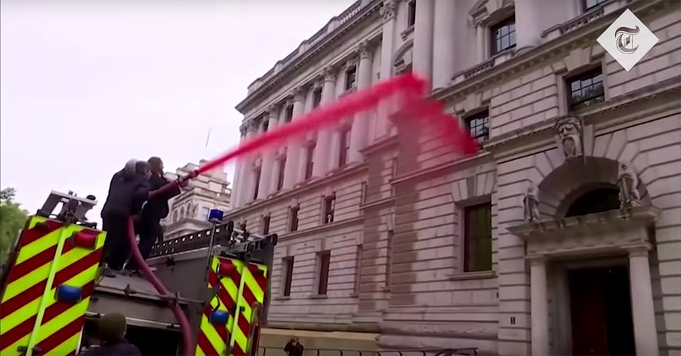 WATCH: Left-Wing activists attempt to spray building with fake blood, fail, and hilarity ensues