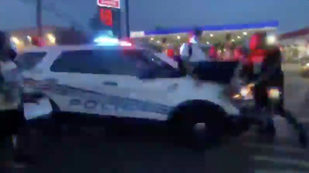 Rioters Attack Cop Car. Cop Car Attacks Back!