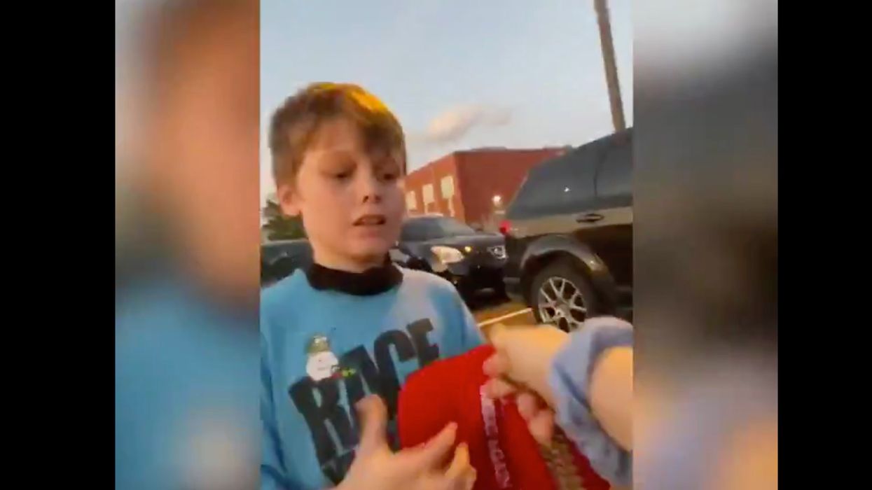 Watch These Biden Supporters Make a 7-Year-Old Trump Supporter Cry and Steal His Hat