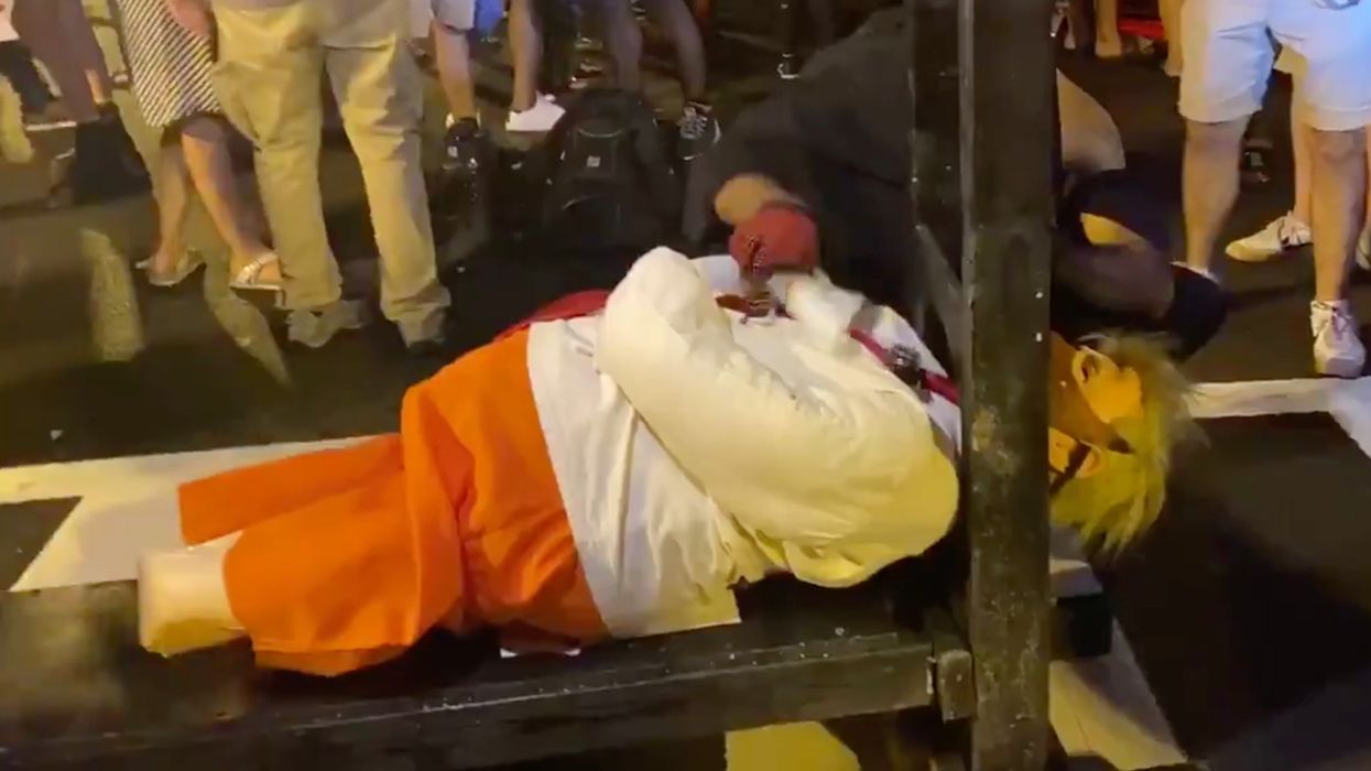 Watch These Biden Supporters Use a Guillotine to Chop Trump's Head Off in Effigy