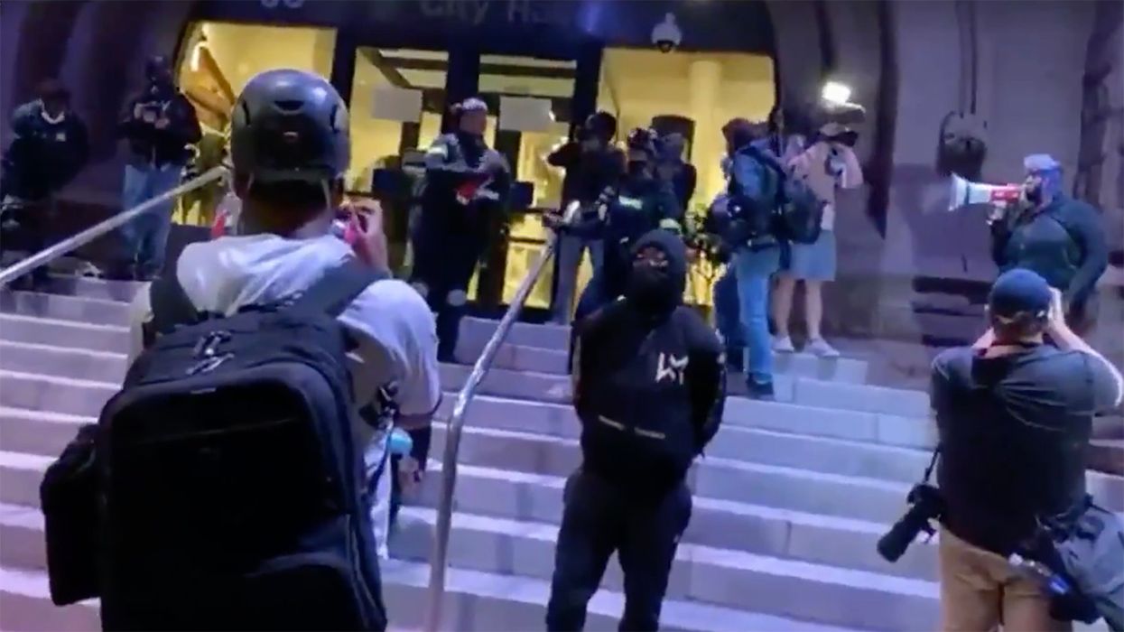 Watch Black Lives Matter's New Tactic: Using White People as Human Shields