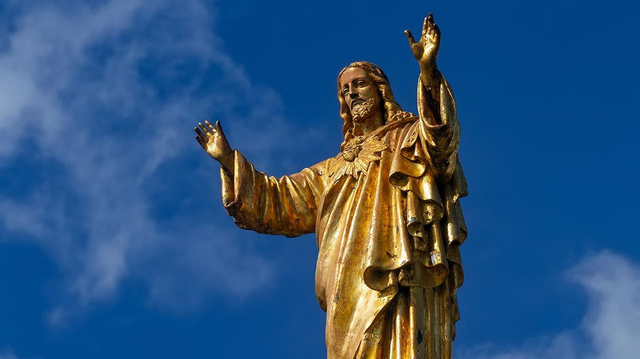 Pro-Abortion Activists Desecrate Jesus Christ Statue with 'God Bless Abortion' Sign