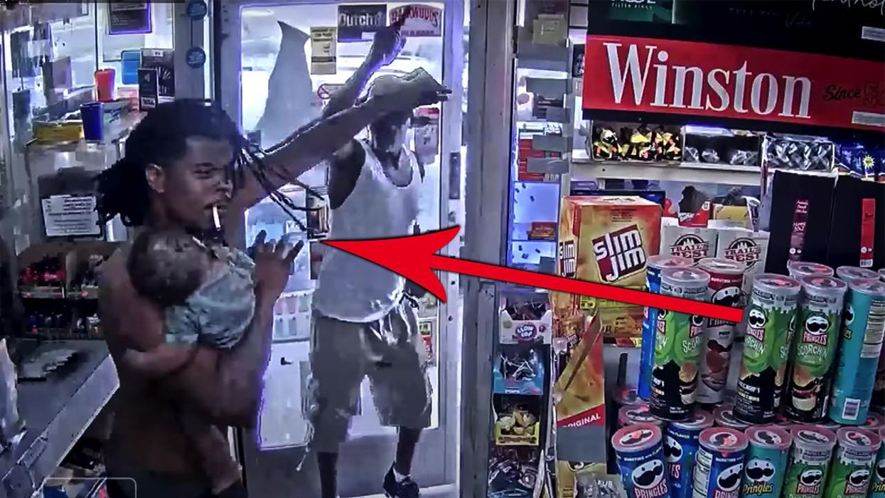 Watch: Dad fights off gunman without waking up the baby he's holding