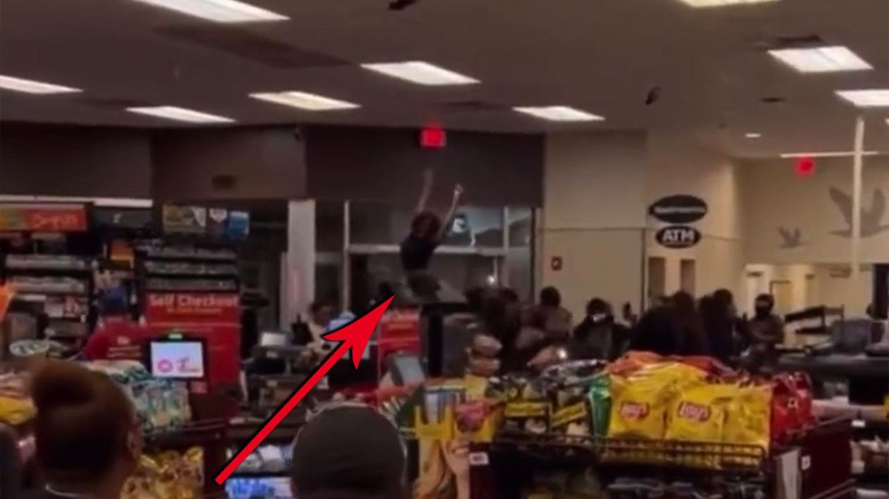 Shocking moment mob of criminals ransacks convenience store, while one girl twerks and another wants her damn sandwich