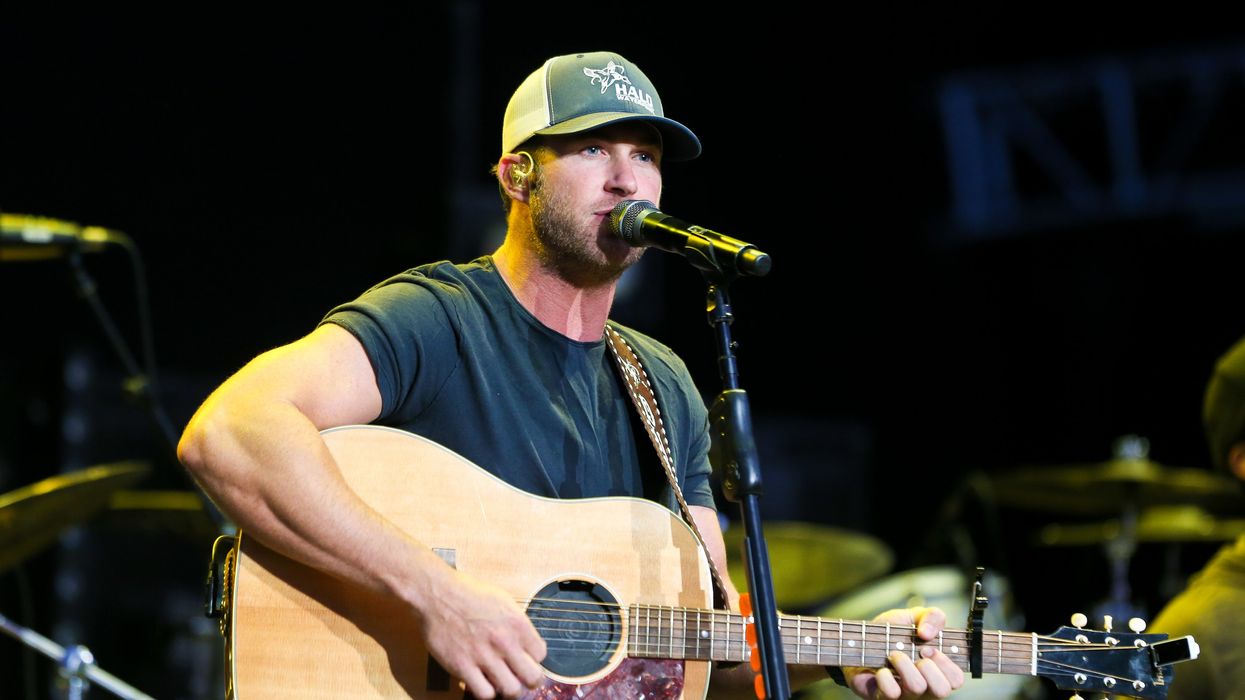 Watch: Country singer replaces "Bud Light" in his song lyrics and a stadium full of Americans explodes with applause