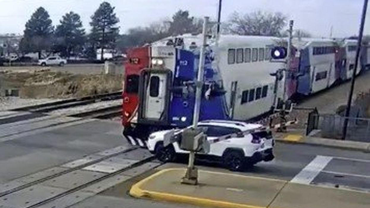 Watch: Driver Jumps Out Of Car SECONDS Before SUV Gets Hit By Train