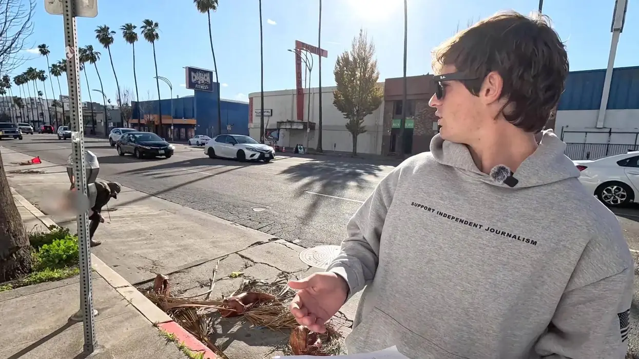 As Nick Shirley exposes California hospice fraud, a woman exposes herself behind him and mistakes street for toilet