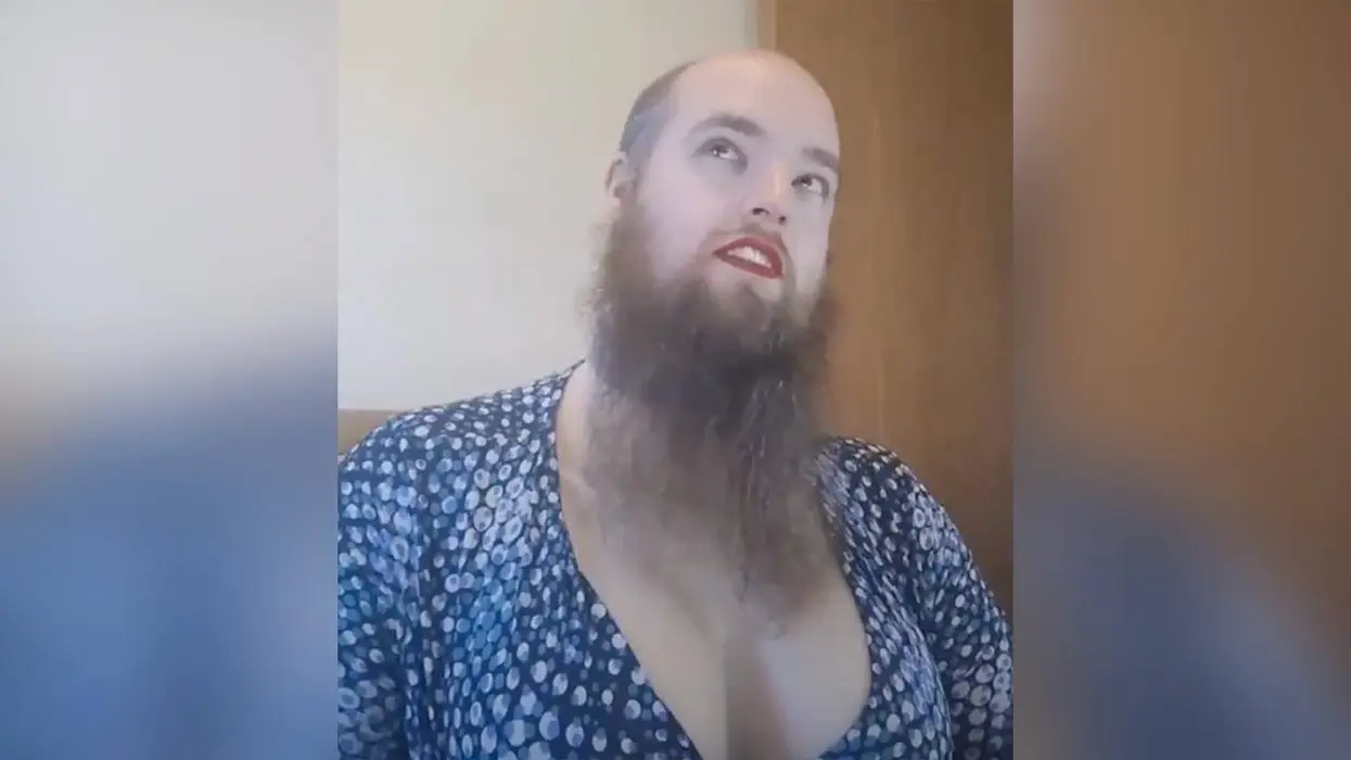 Male lecturer straps on huge, fake knockers before lecturing at a prestigious women's college