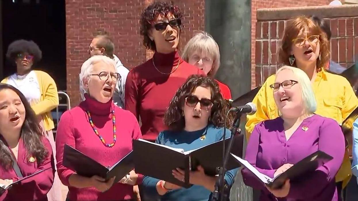 Gay Pride conquers Boston as its flag is raised above City Hall as the choir sings