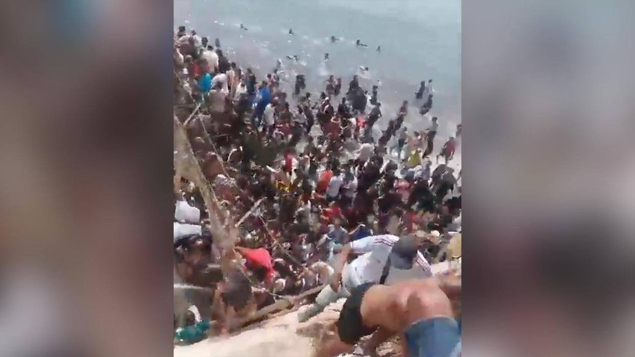 Chaotic Scene Shows African Migrants Storming Spain’s Port