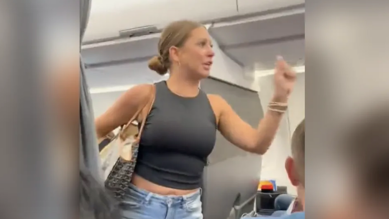 Finally! The "not real" airplane freak-out lady has been identified and there's backstory behind the meltdown