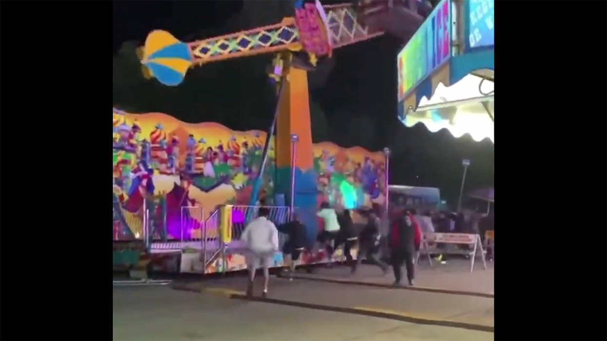 Stunning Video Captures Amusement Park Ride Tipping Over Until Brave Men Rush to Hold It Up