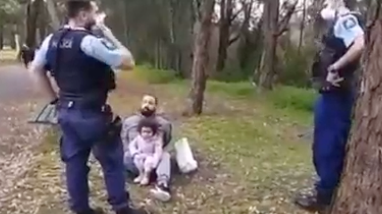 Little Girl Sits on Father's Lap as He's Handcuffed. His Crime? Not Wearing a Mask.