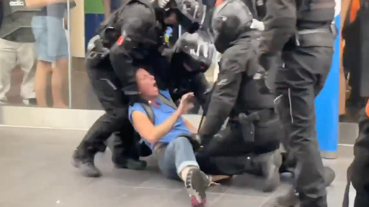 Riot Police Beat Down Woman Who Entered Mall Without Showing Her 'Passport'