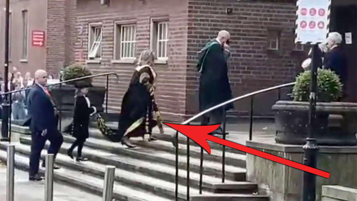 'Go F*** Yourself': Hillary Clinton Gets Heckled as a Child Walks Behind Her Carrying Her Cape