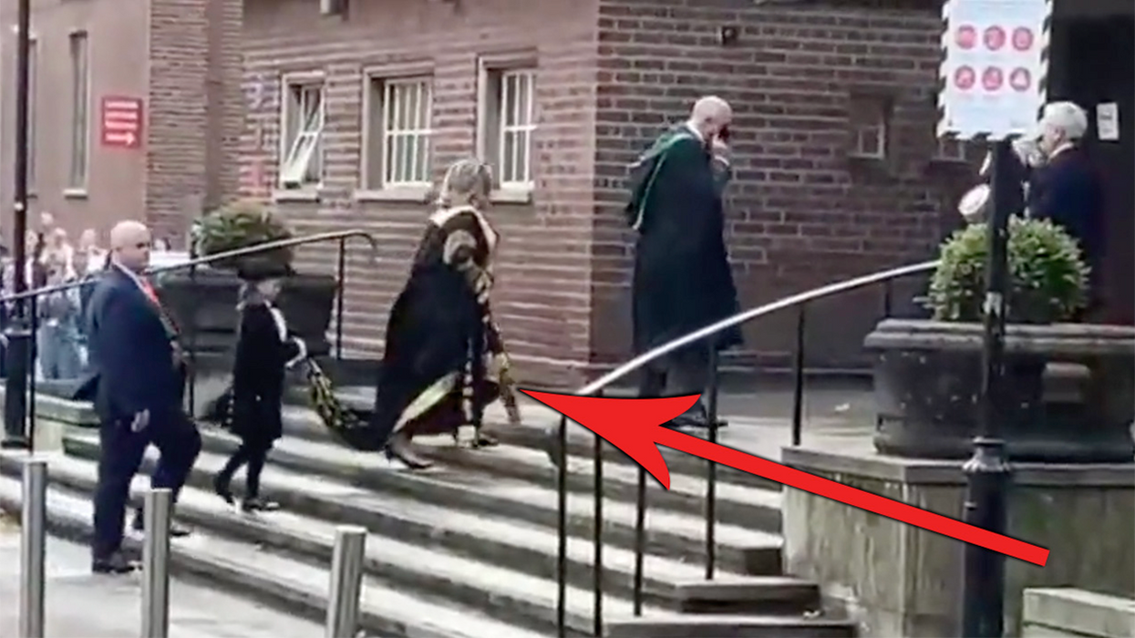 'Go F*** Yourself': Hillary Clinton Gets Heckled as a Child Walks Behind Her Carrying Her Cape