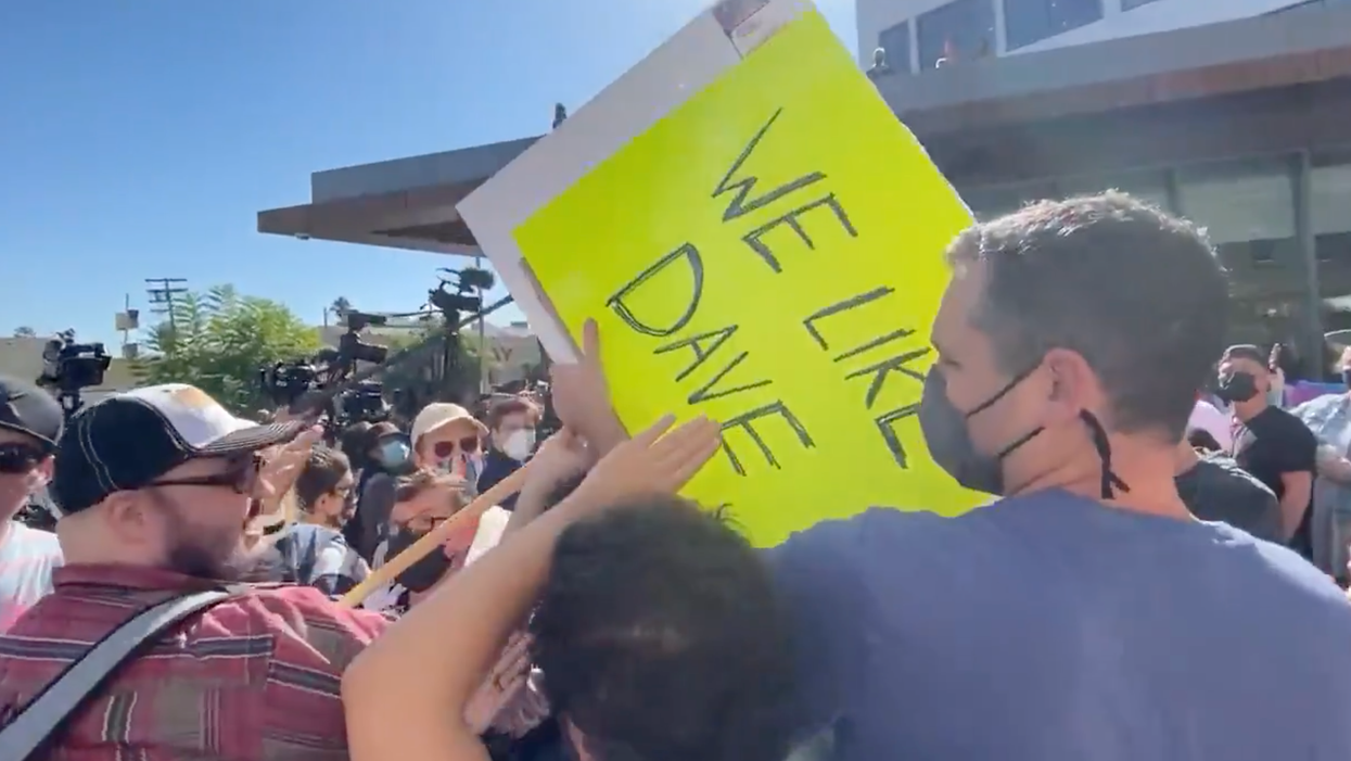 Watch: Netflix Employees Attack Dave Chappelle Fan, Destroy His Sign, Then Claim 'He Has a Weapon'