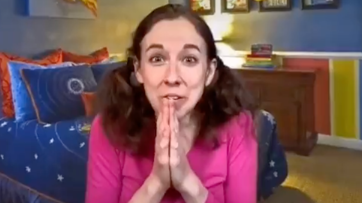 Adult Woman Wears Pig Tails, Sings to Children About Playing Together When They Get 'The Shot'