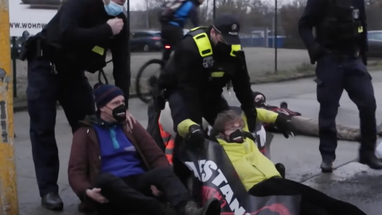 Watch: Totally Normal Activists Glue Themselves to the Road in the Name of Climate Justice