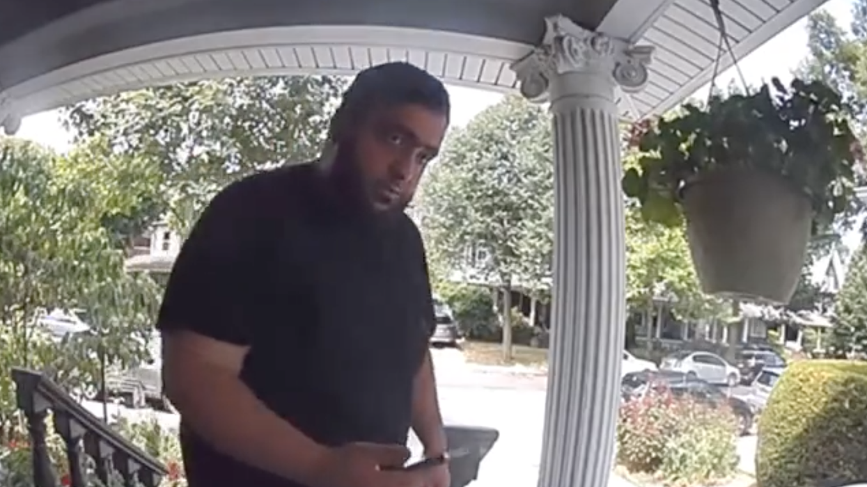 Watch: Iranian man shows up at journalist's home, is later arrested with a loaded AK-47 and a ton of cash