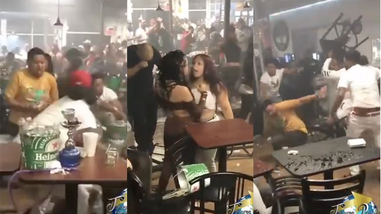 Ludicrous bar brawl is caught on video with fists swinging, chairs flying, and we think someone's boob popped out