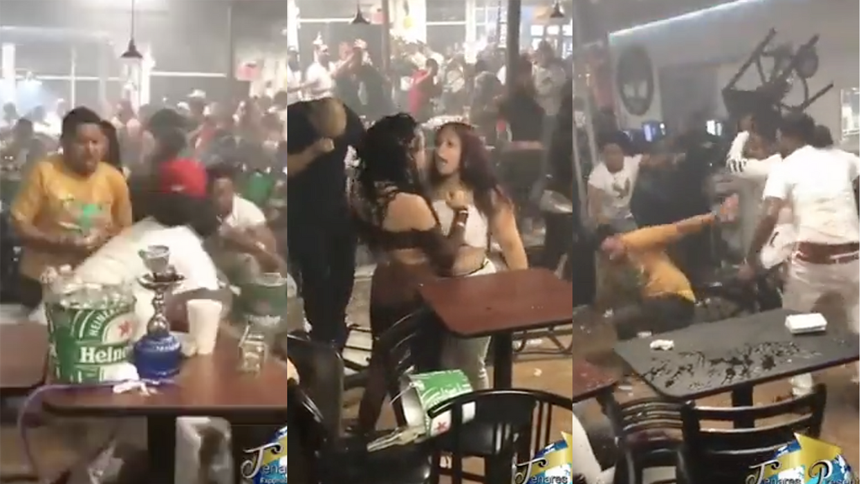 Insane bar brawl is caught on video with fists swinging, chairs flying, and I think someone's boob popped out