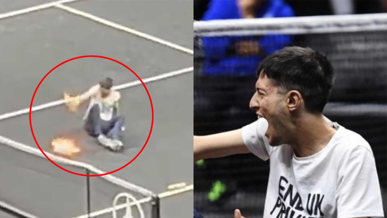 Watch: Climate activist interrupts Roger Federer's last match to set himself on fire for... I guess reasons