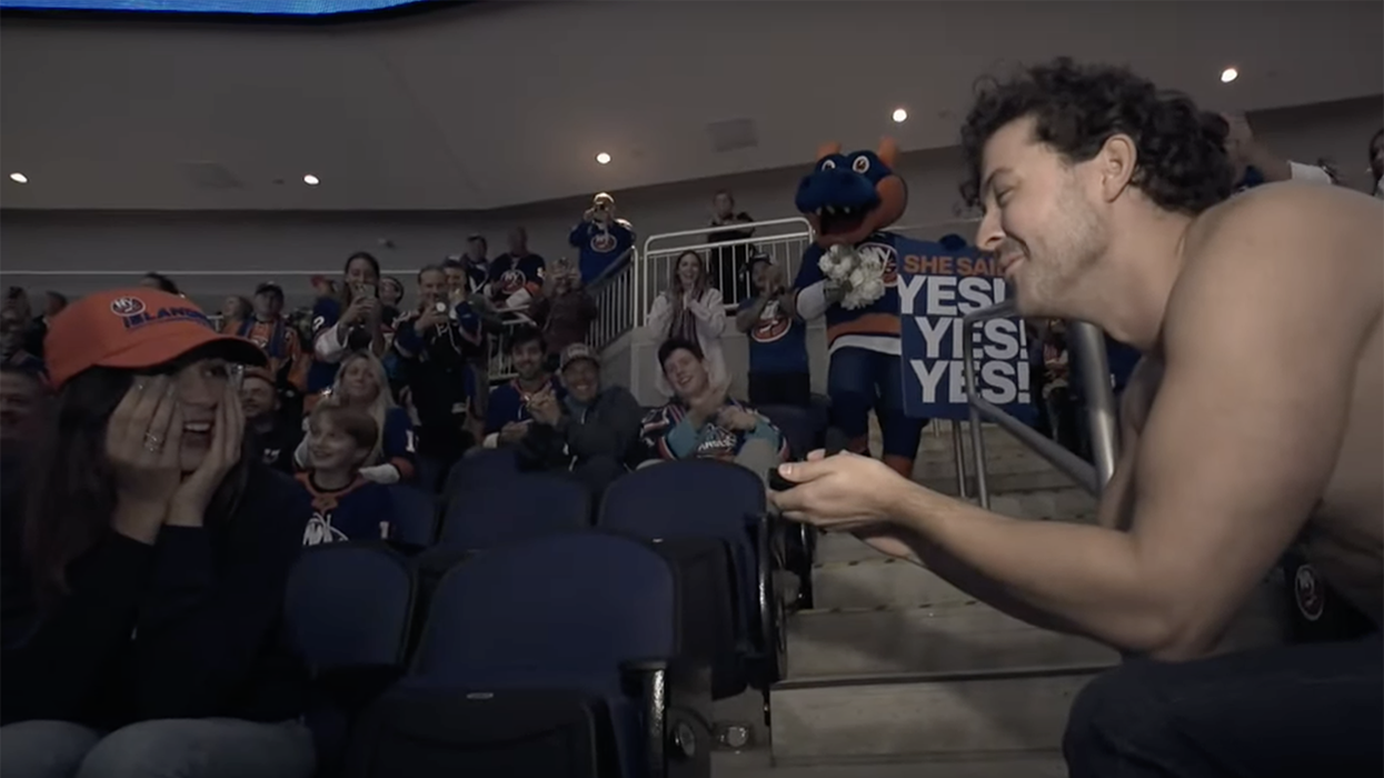 Watch: Shirtless hockey bro proposes to girl on kiss cam... who then runs away from him in embarrassment