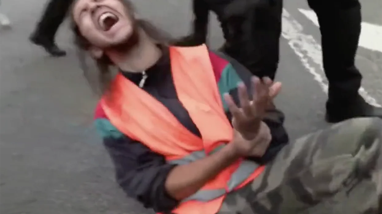 Watch: Silly liberals glue their hands to the street in protest, cry when police aren't gentle removing them