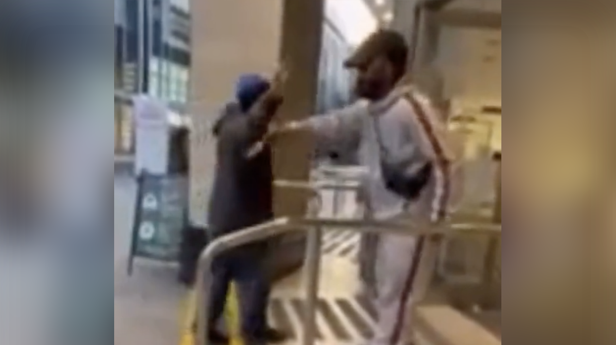 Watch: Legend stands outside building with a lint roller to illustrate how conditioned Americans are to comply