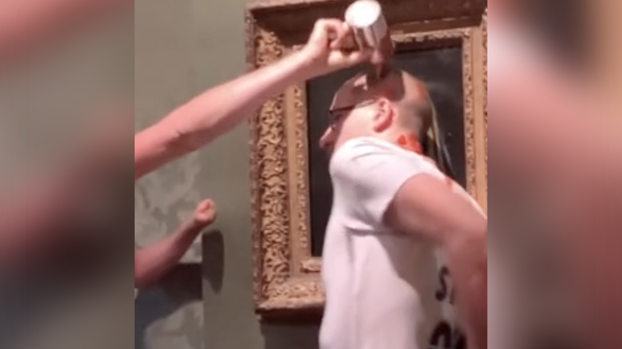 Hands are for wimps! Watch this left-wing protestor glue his entire head to a priceless work of art