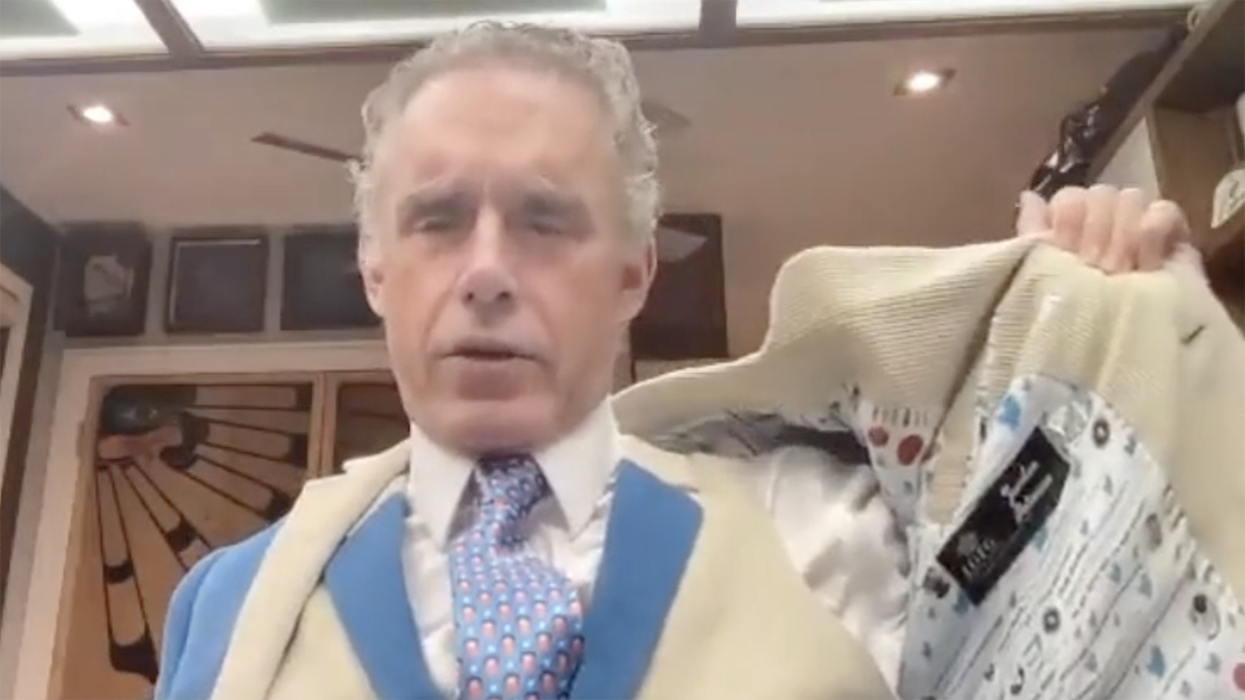 Watch: Jordan Peterson shows off that Big Tech drip in his new Twitter suit, complete with an Elon Musk tie