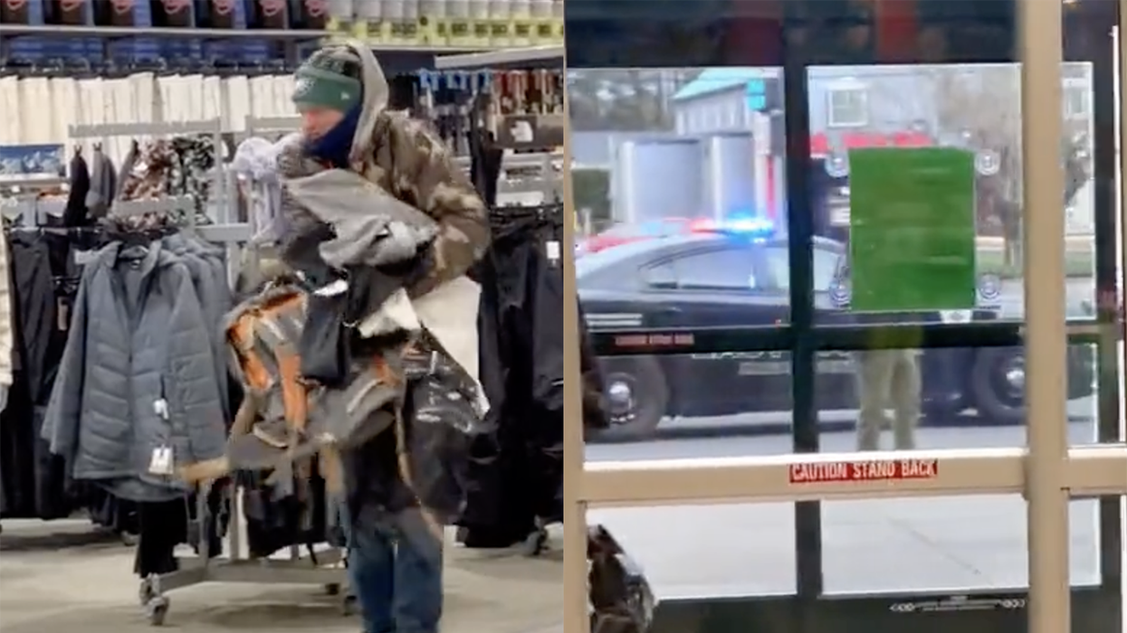 Watch: World's dumbest shoplifter was so busy grabbing clothes he didn't notice the cops outside waiting for him