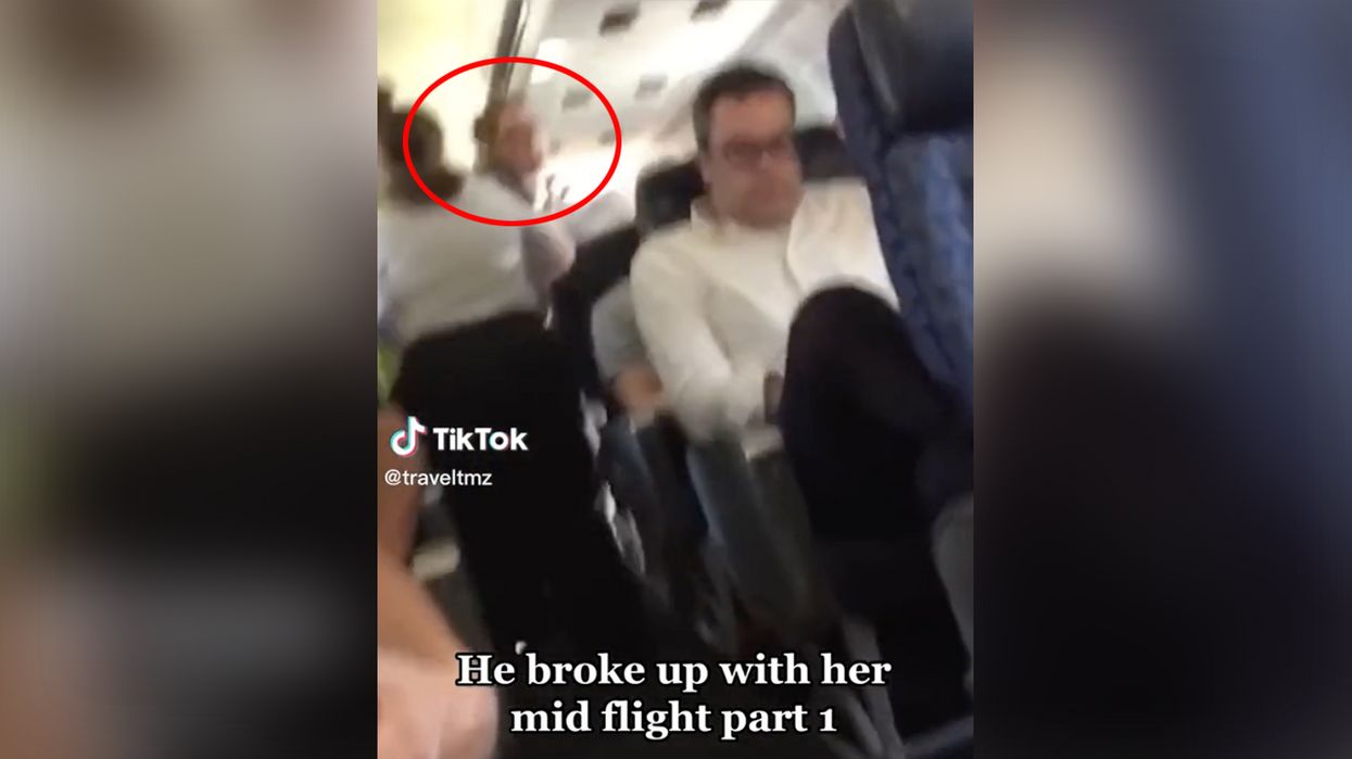 Watch: Girl gets dumped MID-FLIGHT, it takes every flight attendant to handle her freaking out like a lunatic