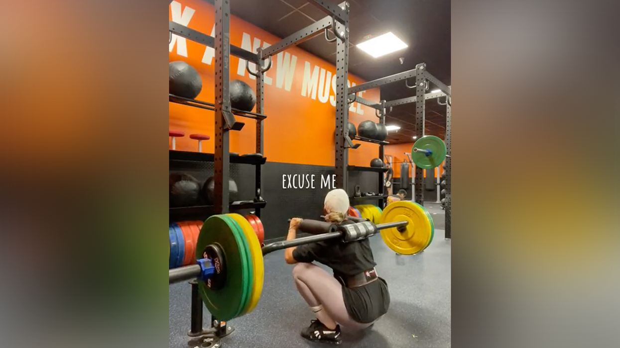 WATCH: Gym lady needs help getting up from a squat, but zero men come to her rescue. Wonder why...