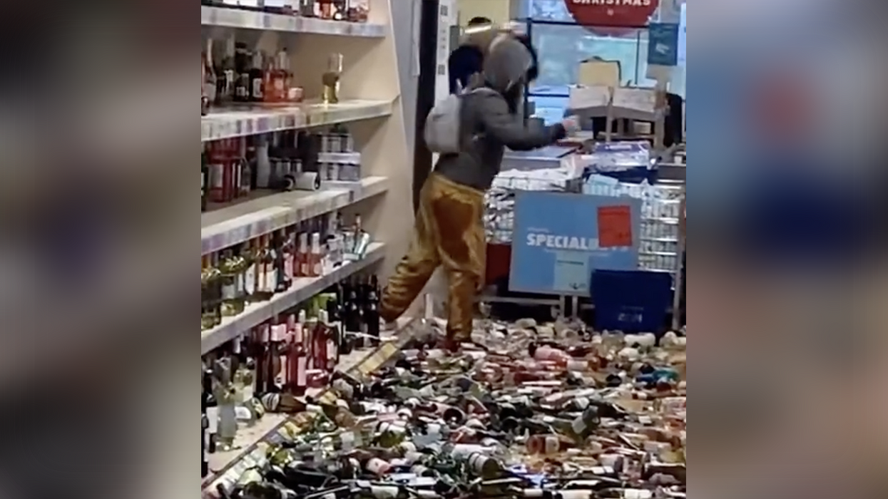 Watch: Woman meltsdown smashing 100s of bottles of booze in what should be considered an act of domestic terrorism