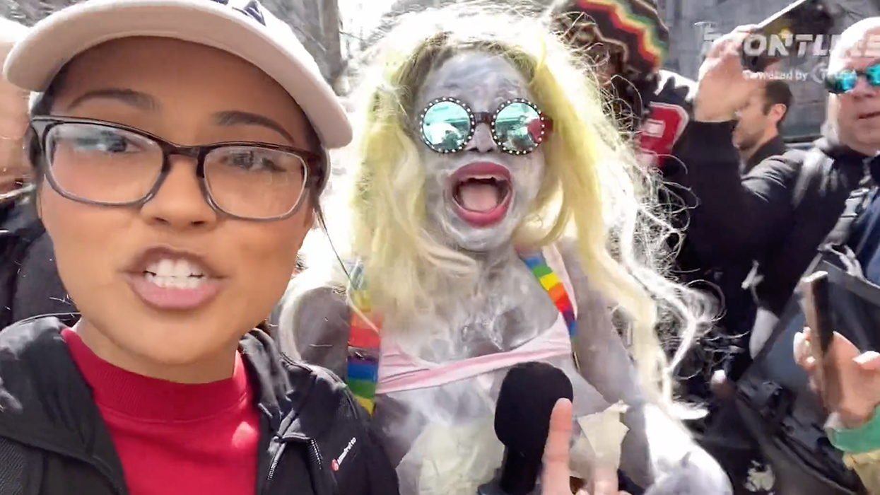 Watch: Crazy lady covers herself in white paint, screams "f*** white people" outside chaotic Trump arraignment