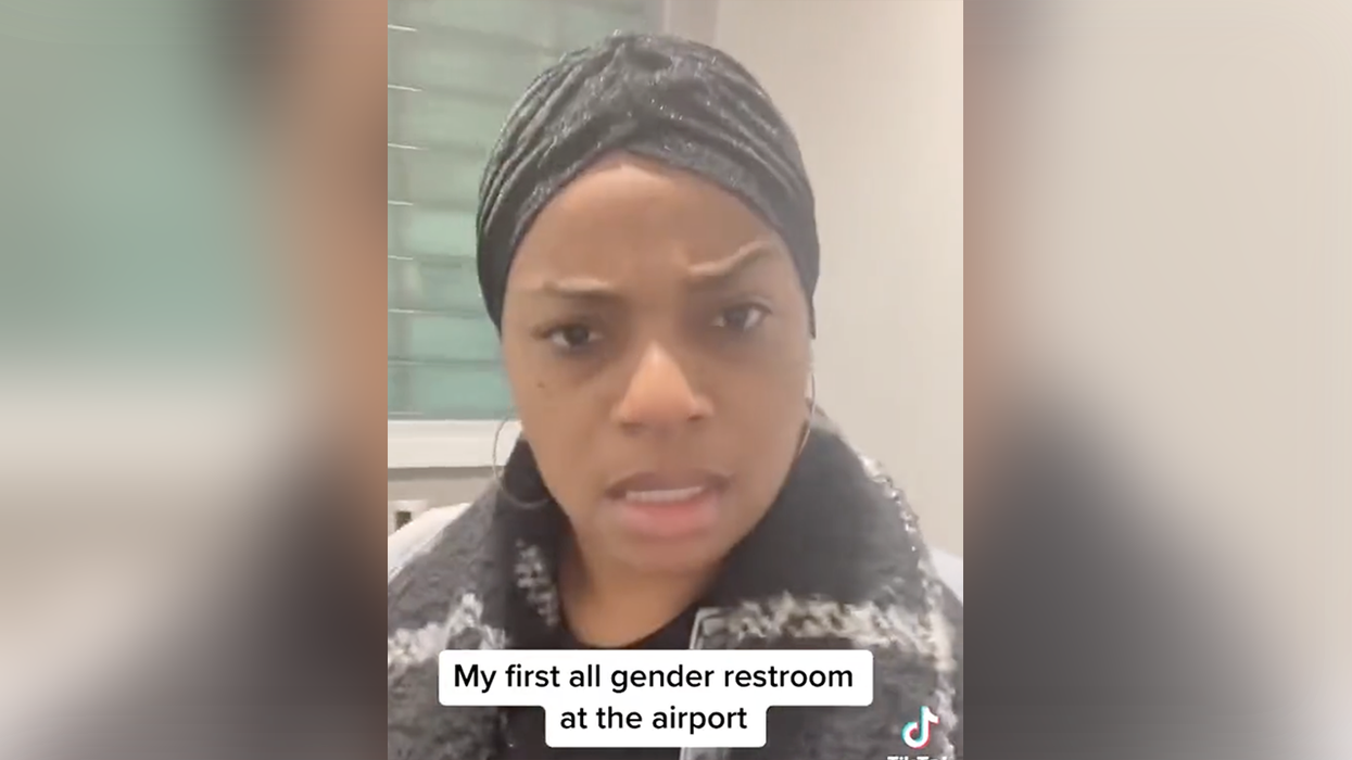 Watch: Woman has hilarious reaction to men "blowing up" the airport's all-gender bathroom