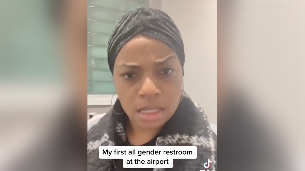 Watch: Woman has hilarious reaction to men "blowing up" the airport's all-gender bathroom