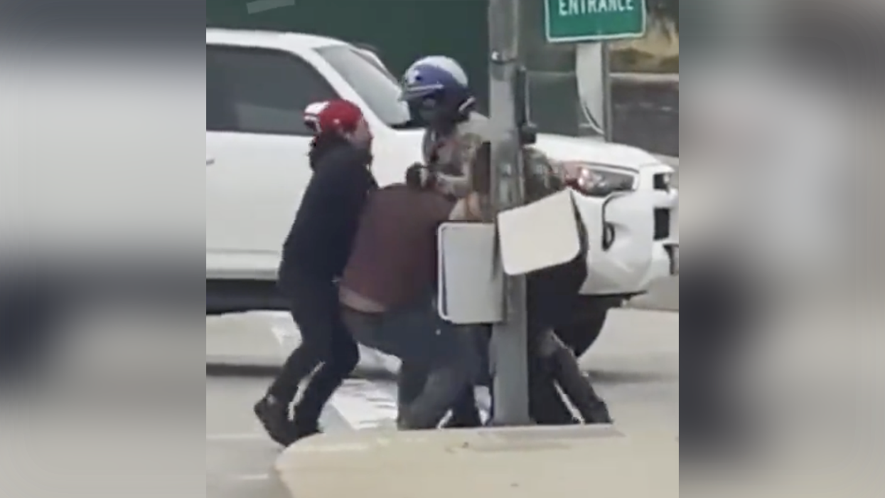 Watch as brave bystanders save the day after goon viciously attacks a motorcycle cop