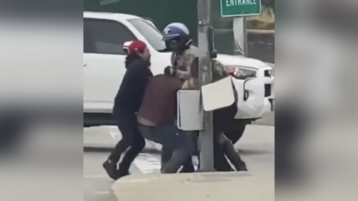 Watch as brave bystanders save the day after goon viciously attacks a motorcycle cop
