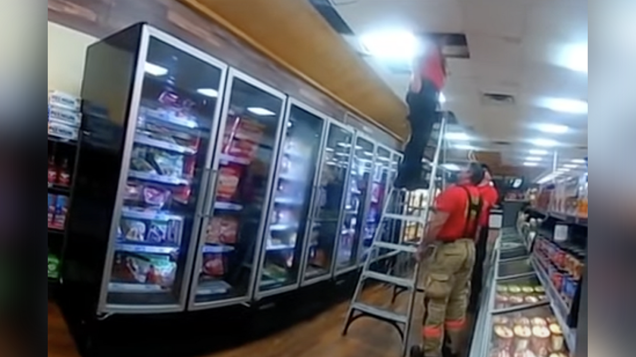 Watch: Man Arrested After Being Caught 'Sleeping' Store Ceiling