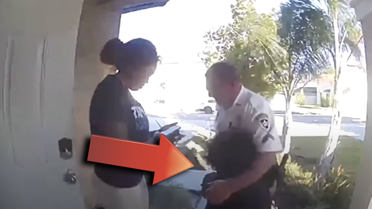 Watch: Little boy rushes to call 911 from cell phone. No emergency. He just wanted to give the cop a hug.