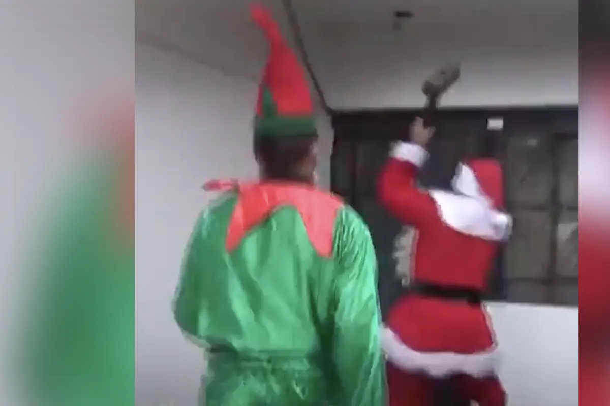 Santa Claus grabs a sledgehammer, confronts drug dealer on the naughty list, while an elf has his six