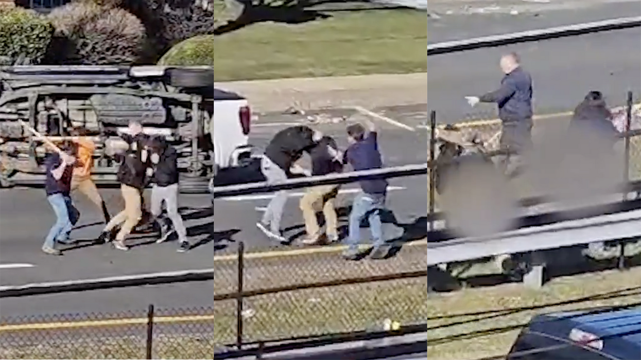 Watch: Car accident turns into wild street fight with an overturned truck, weapons, and we think someone's butt fell out