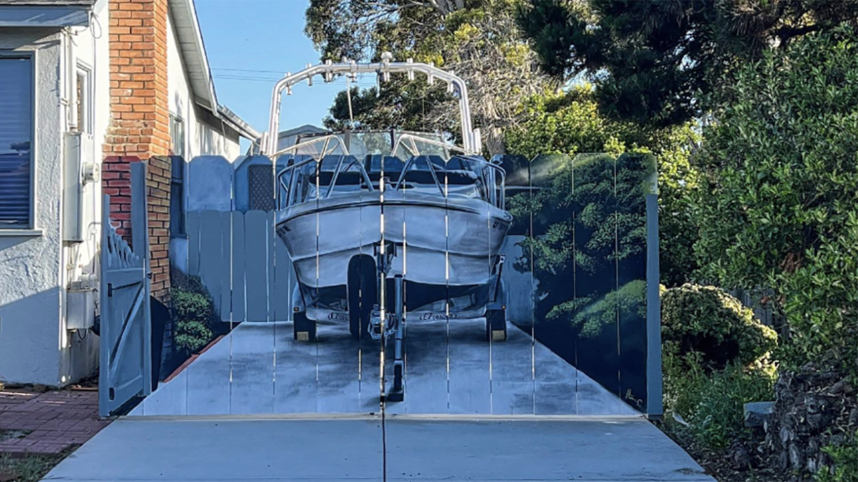 Patriotic and Petty! Man's response to complaints about HIS boat in HIS driveway goes viral, "I like to make a political statement"