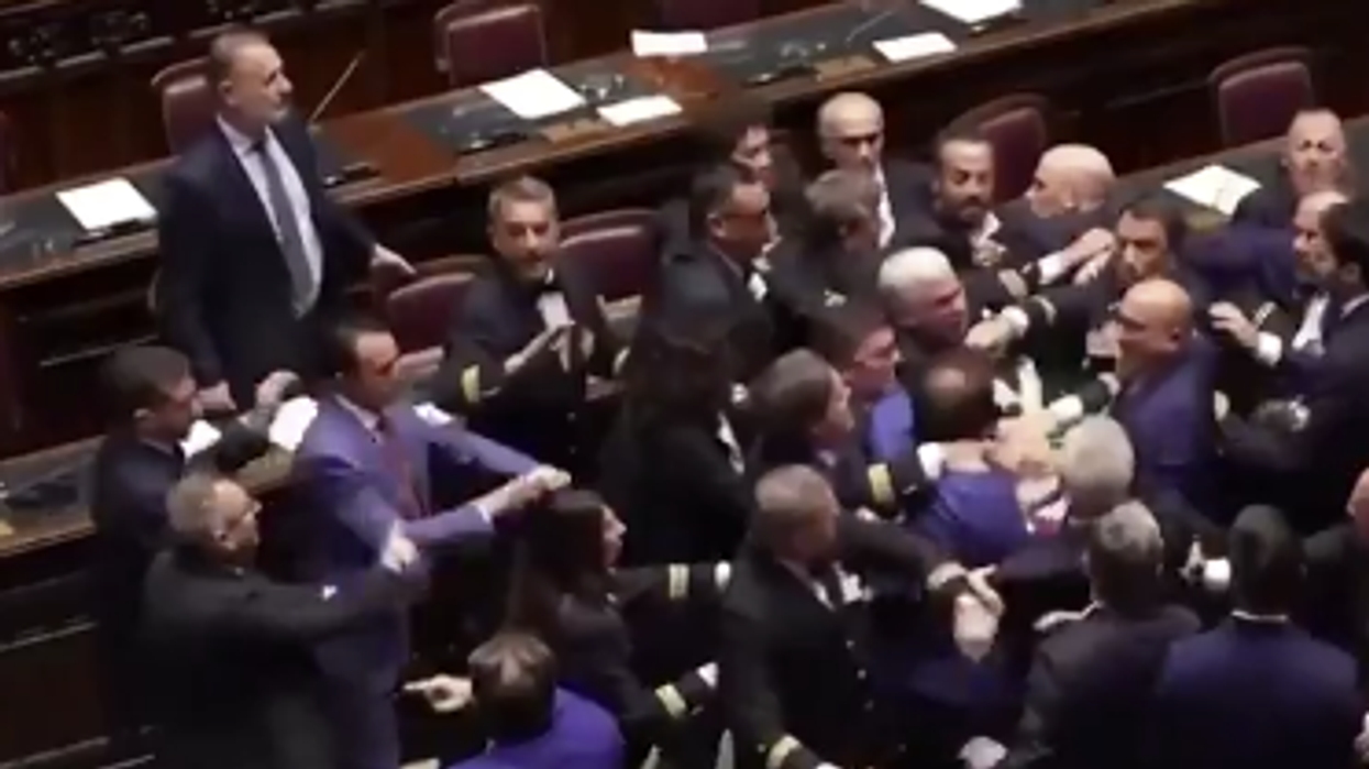 Watch: Wild brawl breaks out in Parliament, one member needed to be rolled away in a wheelchair
