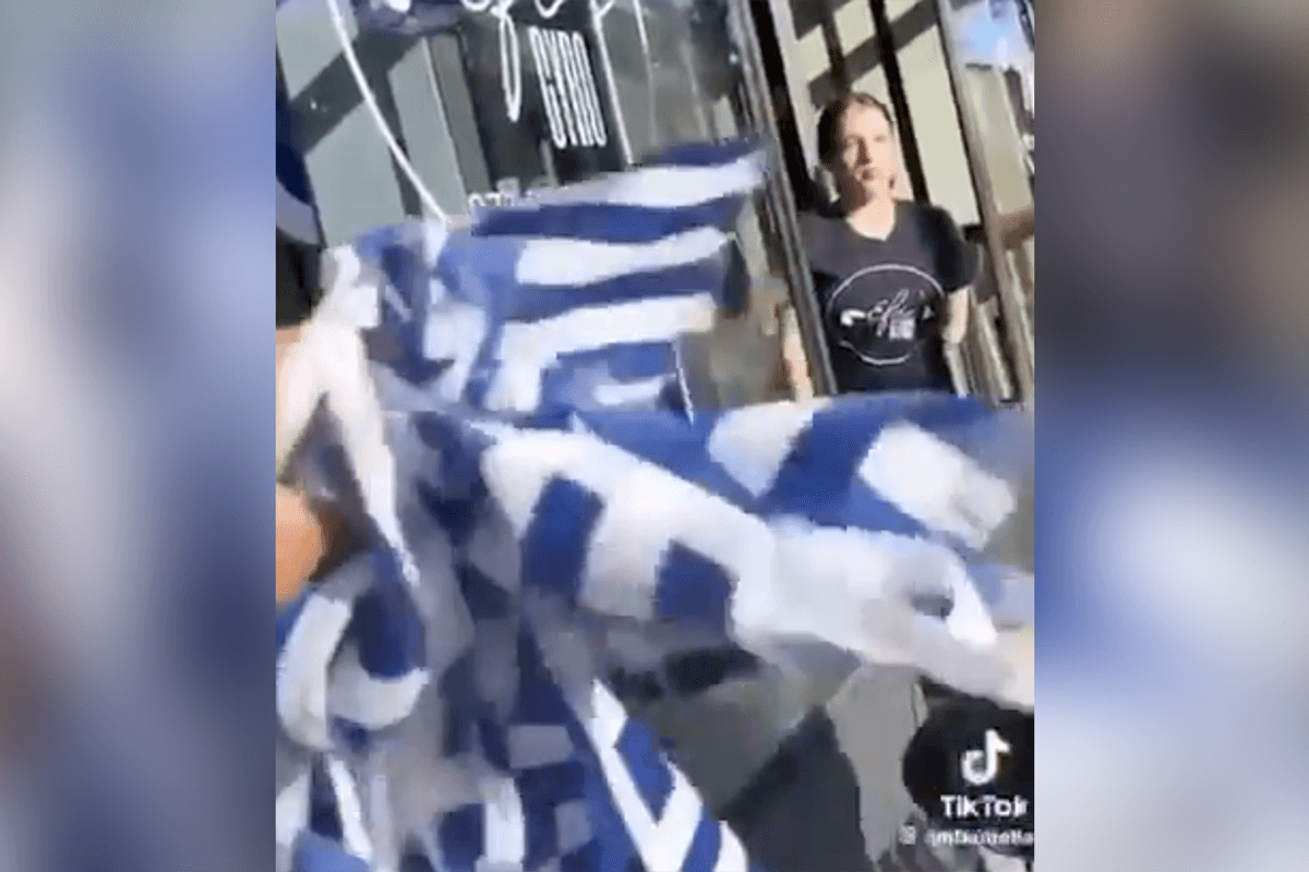 Anti-Israel nincompoop tears down what she THINKS are Jewish flags, but needs a geography lesson