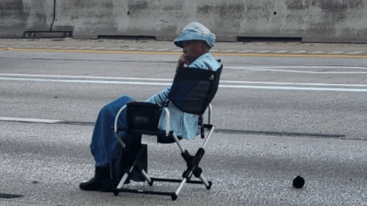 Traffic grinds to a halt when an armed woman takes a seat - an actual seat - in the middle of a Texas highway